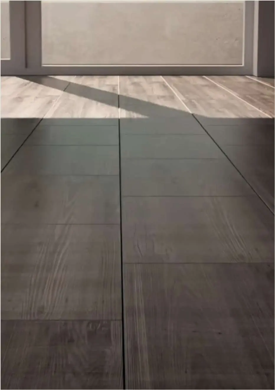 Stone-look tile flooring with a defined grout-effect joint.